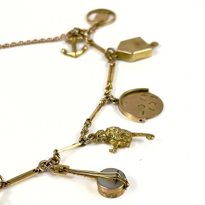 Lot 106 - A 9ct gold charm bracelet.