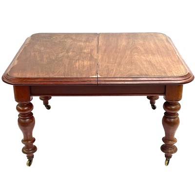 Lot 1827 - A Victorian mahogany extending dining table.