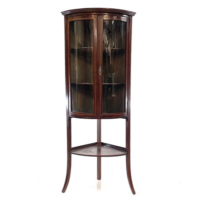 Lot 1831 - A late Victorian mahogany and inlaid bow front corner display cabinet.