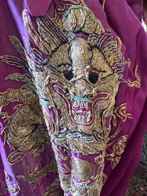 Lot 40 - A large Chinese silk embroidered dragon robe, late 19th century.