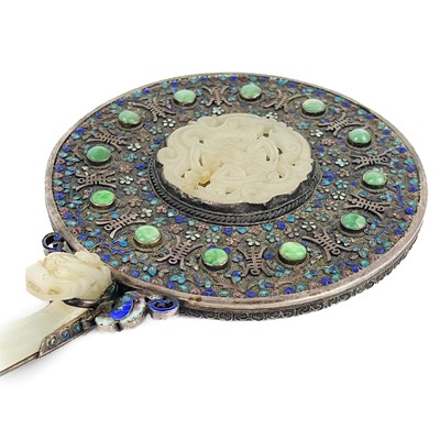 Lot 51 - A Chinese silver and enamel mirror mounted with jade, late 19th century.