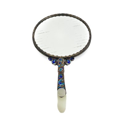 Lot 51 - A Chinese silver and enamel mirror mounted with jade, late 19th century.