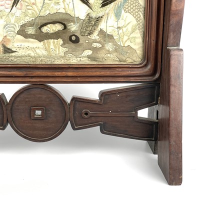 Lot 236 - A Chinese hardwood framed silk embroidered table screen, 19th century.