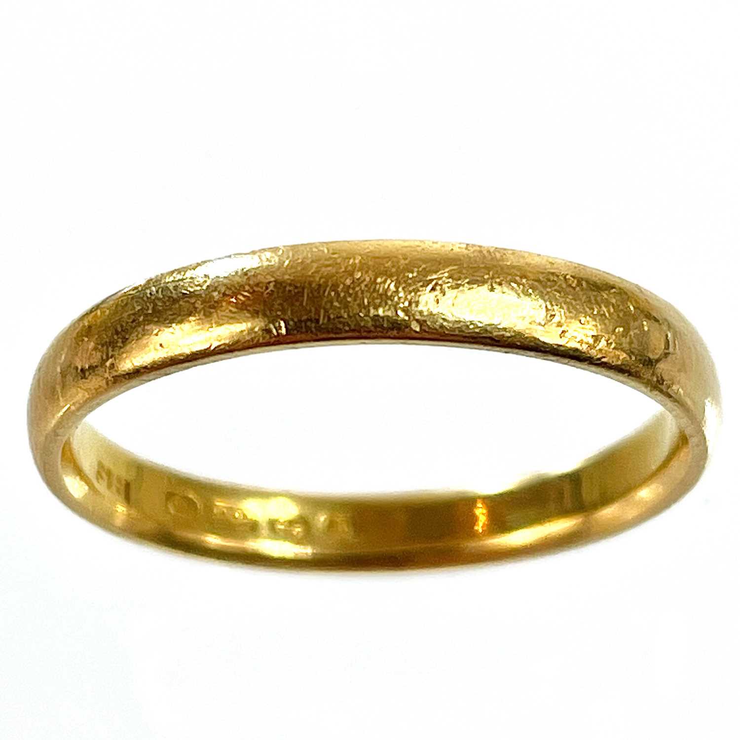 Lot 281 - A 22ct hallmarked gold band ring.