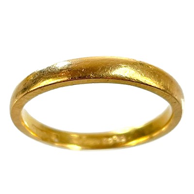 Lot 317 - A 22ct hallmarked gold band ring.