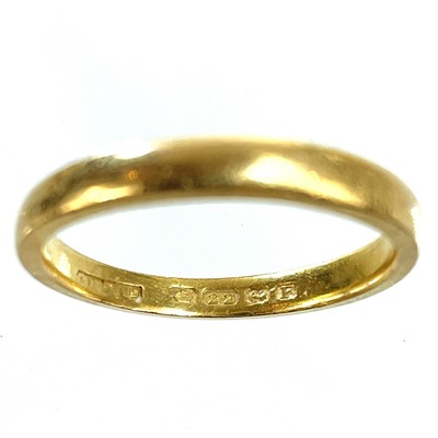 Lot 317 - A 22ct hallmarked gold band ring.