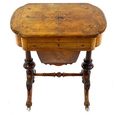 Lot 1803 - A Victorian walnut and inlaid work/writing table.