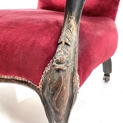 Lot 1900 - A Victorian walnut framed spoon back armchair.