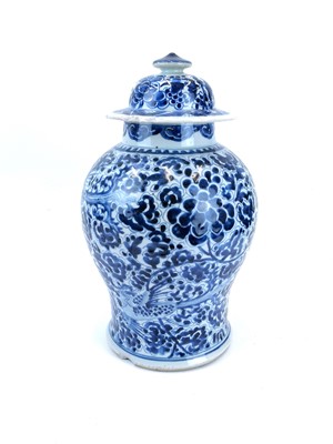 Lot 224 - A Chinese porcelain blue and white baluster vase and cover.