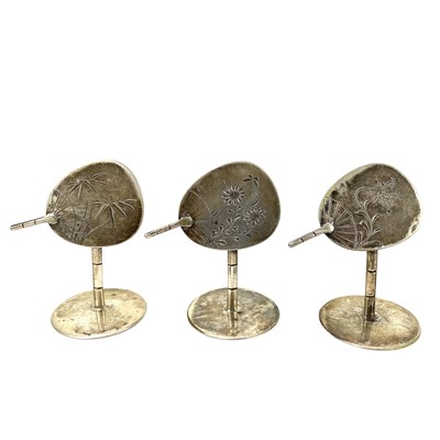 Lot 265 - A set of ten white metal place name holders shaped as hand fans.