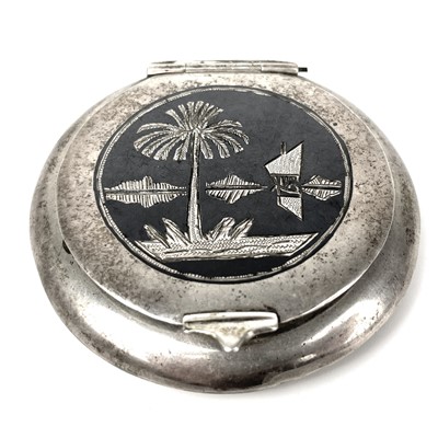 Lot 247 - An Egyptian silver niello circular compact.