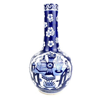 Lot 274 - A Chinese blue and white prunus pattern porcelain bottle vase, 18th century.