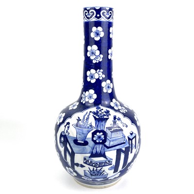 Lot 274 - A Chinese blue and white prunus pattern porcelain bottle vase, 18th century.