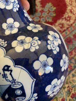 Lot 274 - A Chinese blue and white prunus pattern porcelain bottle vase, 18th century.