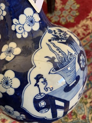 Lot 274 - A Chinese blue and white prunus pattern porcelain bottle vase, 18th century.