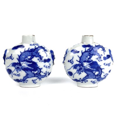 Lot 294 - A pair of Chinese blue and white porcelain dragon snuff bottles, Qing Dynasty, 19th century.