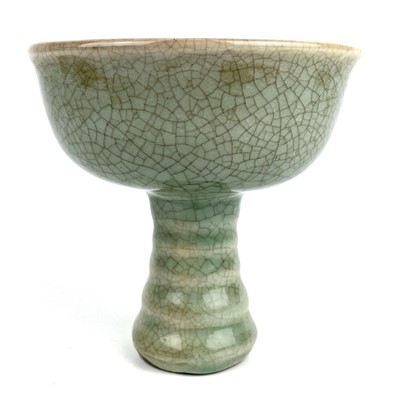 Lot 273 - A Chinese Longquan celadon type crackle glazed stem cup.