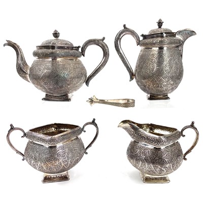 Lot 1044 - A Kashmir four piece silver tea set with finely chased floral pattern.