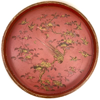 Lot 342 - A large circular red lacquer tray.