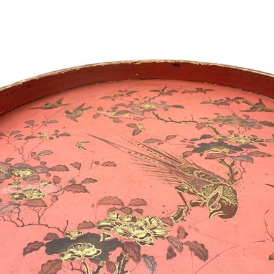 Lot 342 - A large circular red lacquer tray.