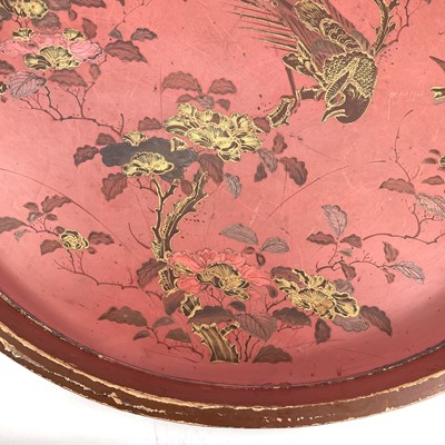 Lot 342 - A large circular red lacquer tray.
