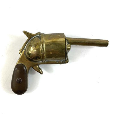 Lot 23 - A rare late Victorian brass vesta case modelled as a pistol.