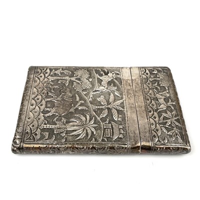 Lot 23 - An Burmese silver card case, decorated with trees and animals