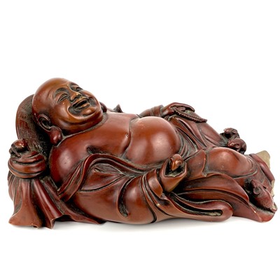 Lot 322 - A Chinese carved stone model of a reclining buddha.