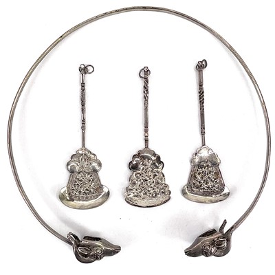 Lot 1043 - An Egyptian neck band with twin goat head finials.