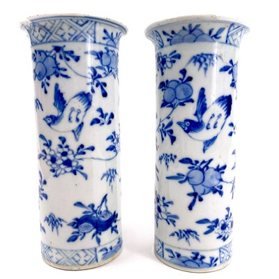 Lot 230 - A pair of Chinese blue and white porcelain cylindrical vases, late 19th century.