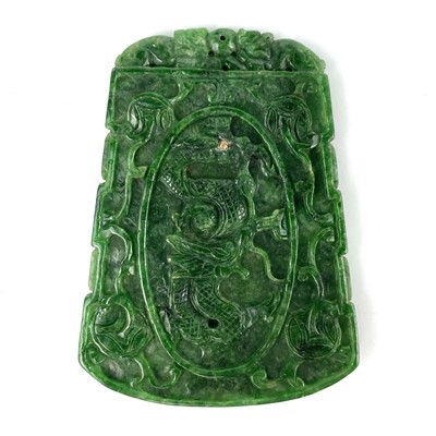 Lot 360 - A Chinese spinach green jade type stone pendant.