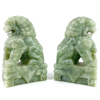 Lot 363 - A pair of Chinese jadeite dogs of fo, 20th century.