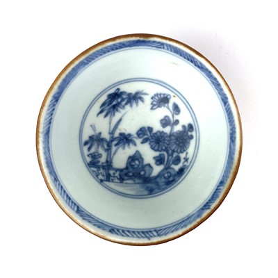 Lot 343 - A Chinese blue and white porcelain Nanking Cargo tea bowl saucer and plate, 18th century.