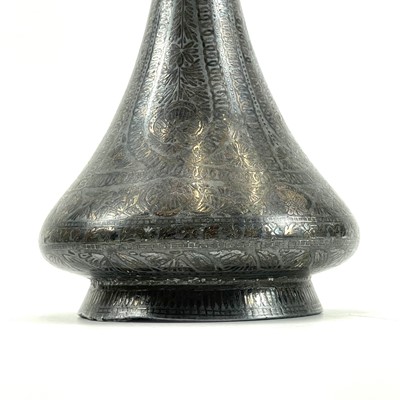 Lot 22 - A 19th century Persian white metal damascened bottle vase.