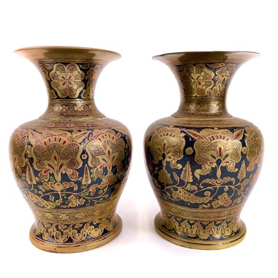 Lot 1056 - A pair of Indian brass and enamel vases.