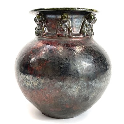 Lot 401 - An early 20th century Raku style Chinese vase with applied buddhas.