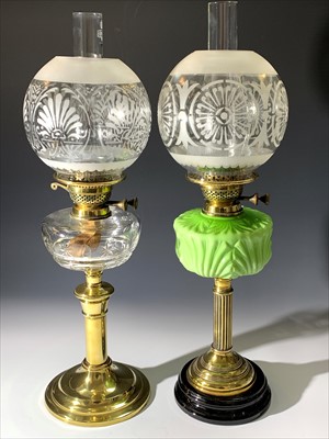 Lot 157 - Two brass and glass oil lamps, early 20th...