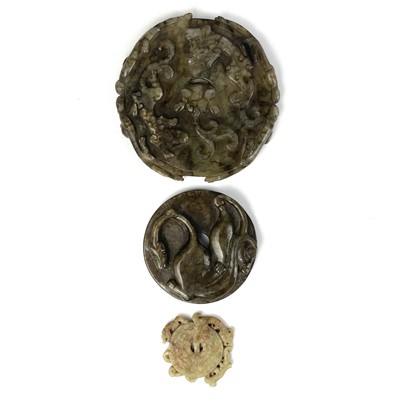 Lot 203 - Three Chinese carved hardstone roundels.