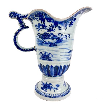 Lot 411 - A 18th century Chinese porcelain blue and white export helmet jug.