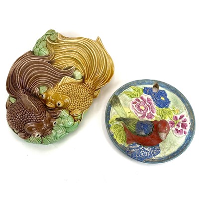 Lot 412 - A Japanese ceramic wall pocket decorated with a parrot.