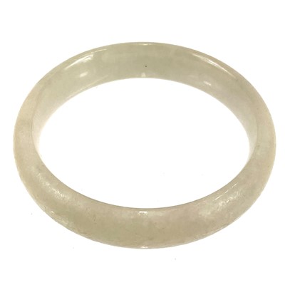 Lot 413 - A jade bangle.