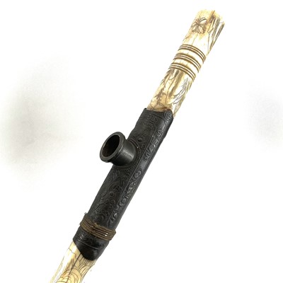 Lot 202 - A Chinese bone opium pipe decorated with scholars.