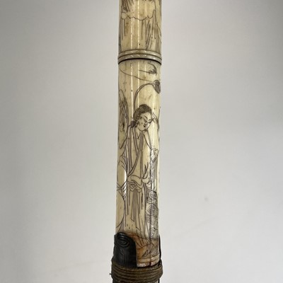 Lot 202 - A Chinese bone opium pipe decorated with scholars.