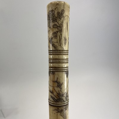 Lot 202 - A Chinese bone opium pipe decorated with scholars.