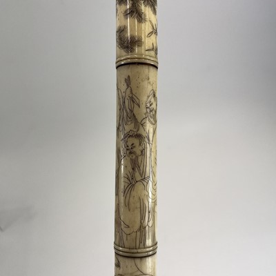 Lot 202 - A Chinese bone opium pipe decorated with scholars.