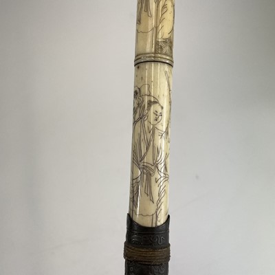 Lot 202 - A Chinese bone opium pipe decorated with scholars.