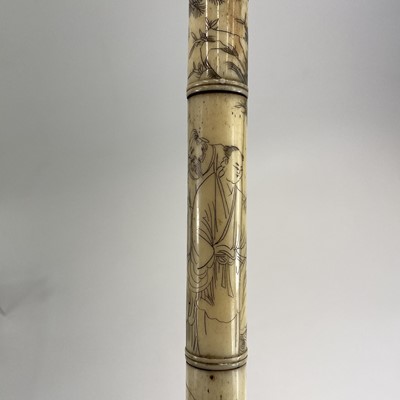 Lot 202 - A Chinese bone opium pipe decorated with scholars.