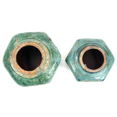 Lot 444 - A Chinese pottery hexagonal vase with moulded flower design panels.