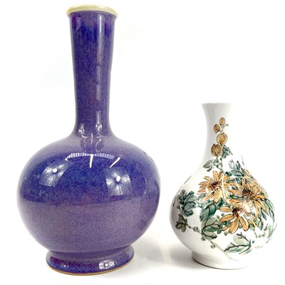 Lot 445 - A Flambe glazed porcelain globular bottle vase makers mark to base.