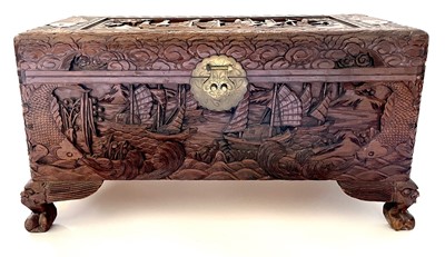 Lot 436 - A Chinese carved camphor wood chest, 20th century.